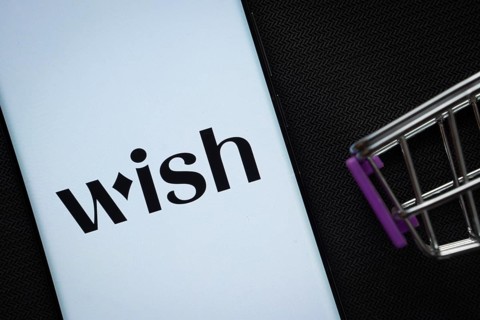 Dhaka, Bangladesh- 03 July 2025: A smartphone displaying the Wish logo next to a miniature shopping