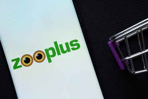 Dhaka, Bangladesh- 03 July 2025: A smartphone displaying the zooplus logo next to a miniature