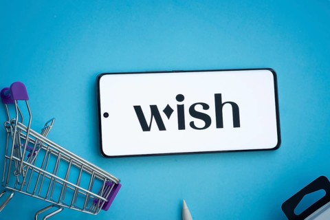 Dhaka, Bangladesh- 03 July 2025: Smartphone displaying Wish logo with shopping cart on a blue