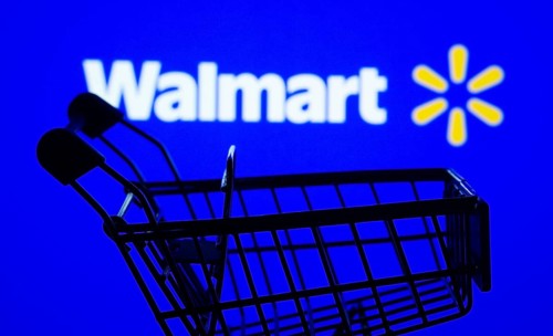 Dhaka, Bangladesh- 03 July 2025: Silhouette of a shopping cart in front of the Walmart logo,