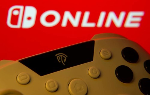 Dhaka, Bangladesh- 15 July 2025: Game controller in front of nintendo online logo on a background