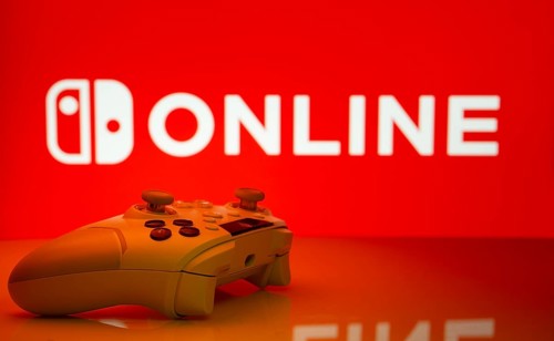 Dhaka, Bangladesh- 15 July 2025: Game controller in front of nintendo online logo on a background