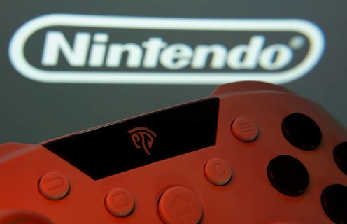 Dhaka, Bangladesh- 15 July 2025: A close-up of a gamepad with the nintendo seen on screen in the