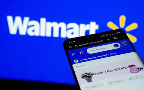 Dhaka, Bangladesh- 03 July 2025: Smartphone displaying Walmart web interface against Walmart logo