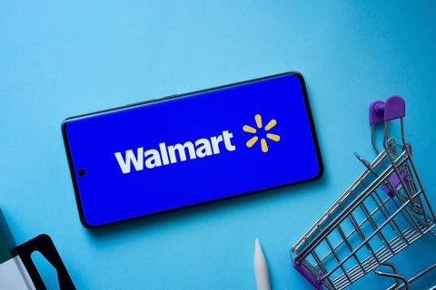Dhaka, Bangladesh- 03 July 2025: Smartphone displaying Walmart logo with shopping cart on a blue
