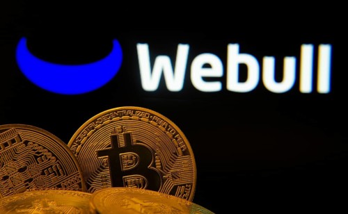 Dhaka, Bangladesh- 04 April 2025: Close-up of Bitcoin coins with the webull logo visible on a