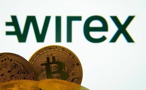 Dhaka, Bangladesh- 27 July 2025: Close-up of Bitcoin coins with the wirex logo visible on a screen