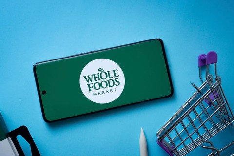 Dhaka, Bangladesh- 03 July 2025: Smartphone displaying Whole Foods Market logo with shopping cart