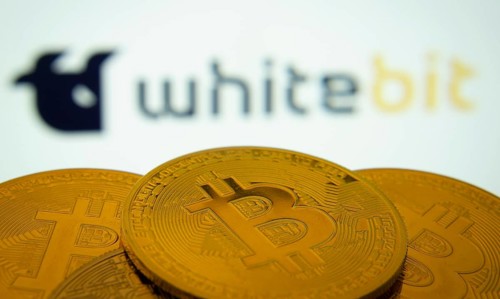 Dhaka, Bangladesh- 03 Sep 2025: Close-up of Bitcoin coins with the whitebit logo visible on a
