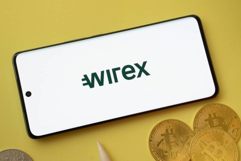 Dhaka, Bangladesh- 26 Aug 2025: wirex logo on smartphone screen near Bitcoin coin and QR code on