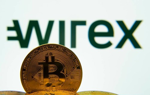 Dhaka, Bangladesh- 04 April 2025: Close-up of Bitcoin coins with the wirex logo visible on a screen