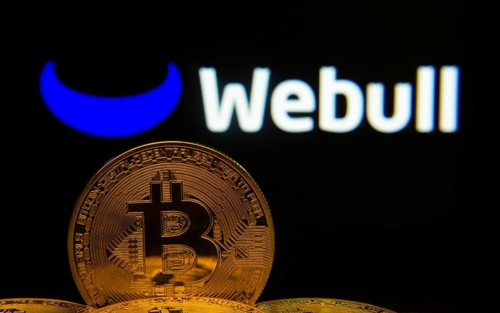 Dhaka, Bangladesh- 04 April 2025: Close-up of Bitcoin coins with the webull logo visible on a