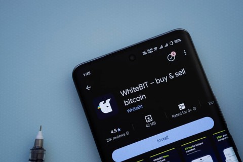 Dhaka, Bangladesh- 29 May 2025: On a blue surface, a smartphone displays the Whitebit app within