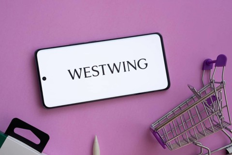 Dhaka, Bangladesh- 03 July 2025: Smartphone displaying Westwing logo alongside a shopping cart on a