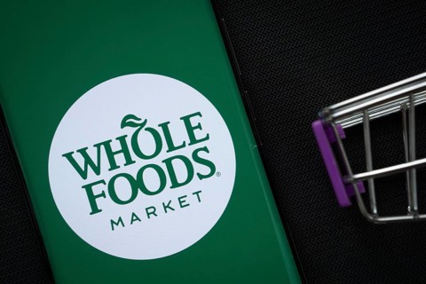 Dhaka, Bangladesh- 03 July 2025: A smartphone displaying the Whole Foods Market logo next to a