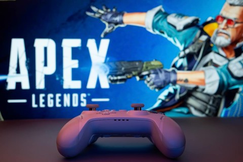 Dhaka, Bangladesh- 19 Sep 2025: A close-up of a white gamepad with the Apex Legends seen on screen