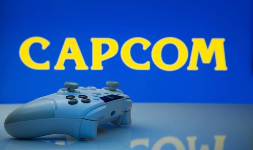 Dhaka, Bangladesh- 19 Sep 2025: A close-up of a white gamepad with the Capcom seen on screen in the