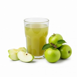 A refreshing glass of apple juice is presented alongside fresh green apples, some whole and others