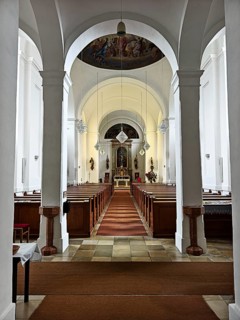 Interior view of a church with altar, arches and wooden pews, Kammersdorf Hollabrunn Weinviertel