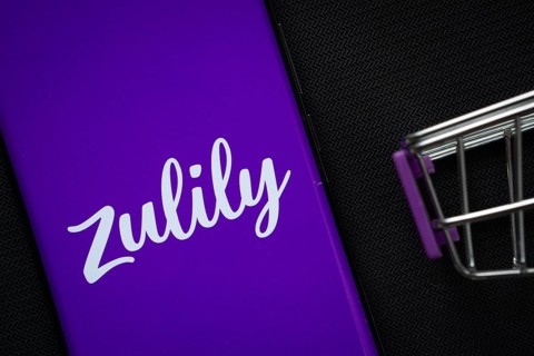 Dhaka, Bangladesh- 03 July 2025: A smartphone displaying the Zulily logo next to a miniature