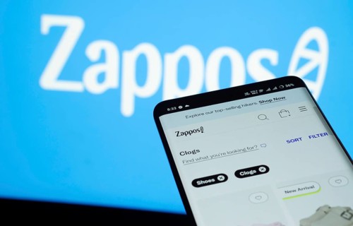 Dhaka, Bangladesh- 03 July 2025: Smartphone displaying Zappos web interface against Zappos logo