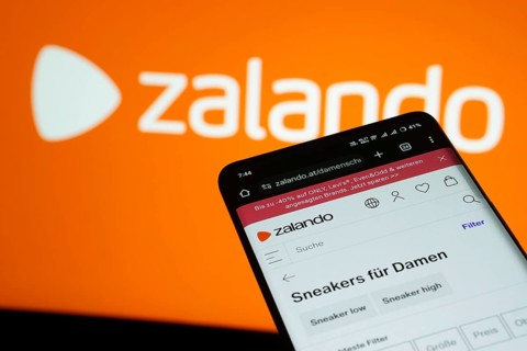 Dhaka, Bangladesh- 03 July 2025: Smartphone displaying Zalando web interface against Zalando logo