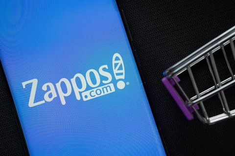 Dhaka, Bangladesh- 03 July 2025: A smartphone displaying the Zappos logo next to a miniature
