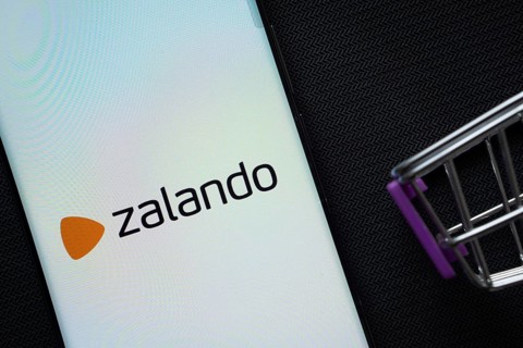 Dhaka, Bangladesh- 03 July 2025: A smartphone displaying the Zalando logo next to a miniature