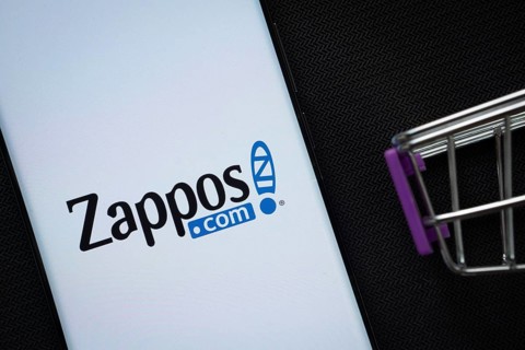 Dhaka, Bangladesh- 03 July 2025: A smartphone displaying the Zappos logo next to a miniature