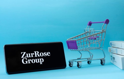 Dhaka, Bangladesh- 03 July 2025: Smartphone with Zur Rose Group logo next to a small shopping cart