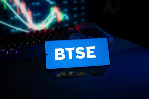 BTSE logo on smartphone with coins and stock chart, suggesting finance and digital market