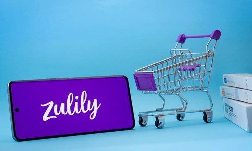 Dhaka, Bangladesh- 03 July 2025: Smartphone with Zulily logo next to a small shopping cart and