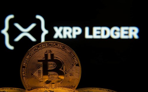Dhaka, Bangladesh- 03 Sep 2025: Close-up of Bitcoin coins with the XRP Ledger logo visible on a