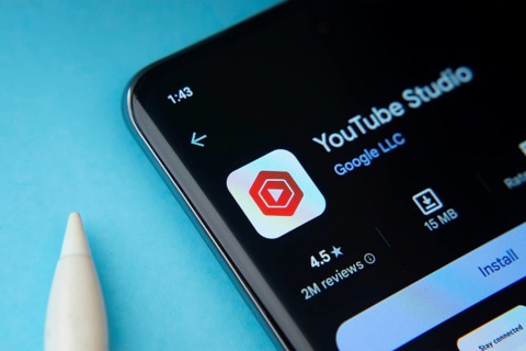 Dhaka, Bangladesh- 29 May 2025: On a blue surface, a smartphone displays the youtube studio app
