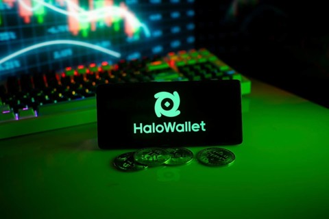 HaloWallet logo with coins and market graph under green neon lighting