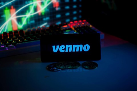 Venmo logo with coins and market activity graph in vibrant neon atmosphere