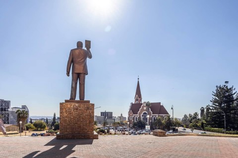 The bronze statue of Dr. Sam Nujoma and Christuskirche is a historic Lutheran church in Windhoek,