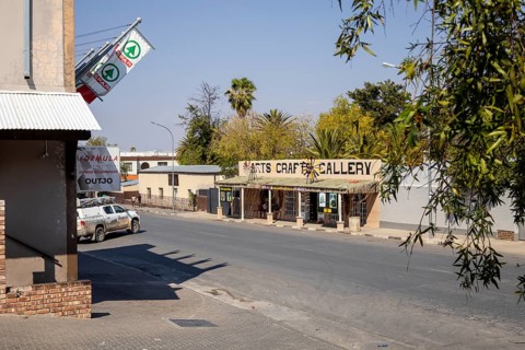 Street view of a modern building with a restaurant or café entrance in Outjo, Namibia 12 Augusto