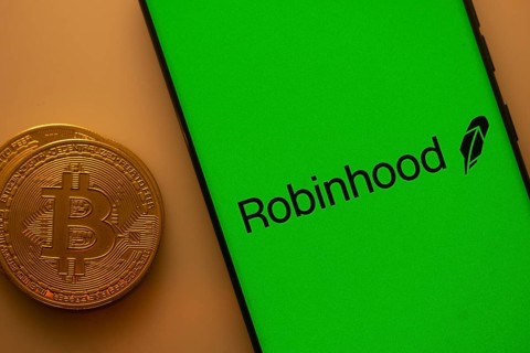 Robinhood logo on a smartphone screen with a Bitcoin coin