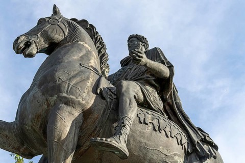 Close-up of a historical equestrian statue focussing on details of horse and rider Marcus Aurelius,