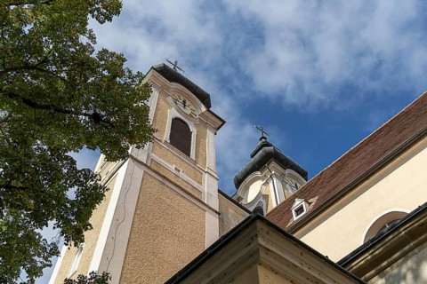 Baroque church towers with clocks against a blue sky, Gothic architectural details, St Stephan's