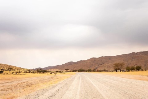 Dirt Road in Solitaire, Namibia, located on the edge of the Namib Desert, surrounded by dunes and