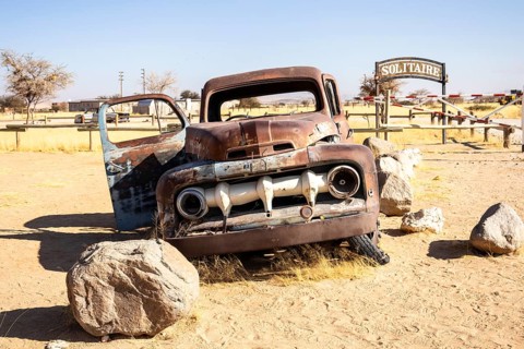 Solitaire's car graveyard in Namibia 27 August, 2025: features rusted vintage cars near small