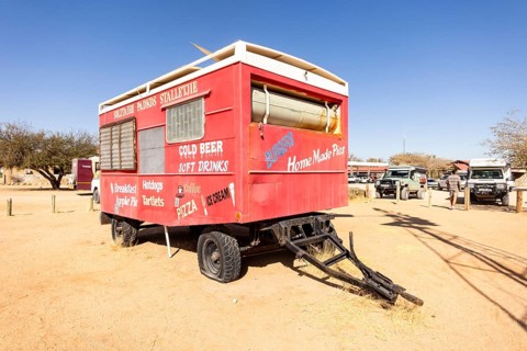 Solitaire's car graveyard in Namibia - 27 August, 2025: features rusted vintage cars near small
