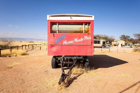 Solitaire's car graveyard in Namibia - 27 August, 2025: features rusted vintage cars near small