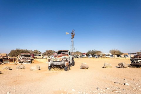 Solitaire's car graveyard in Namibia - 27 August, 2025: features rusted vintage cars near small