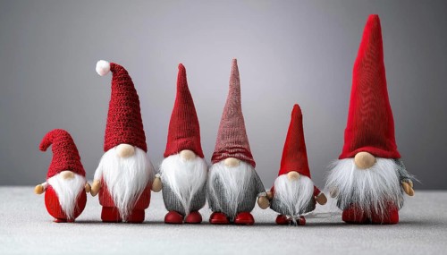 Group of christmas gnomes with red hats and white beards standing together on gray background, AI