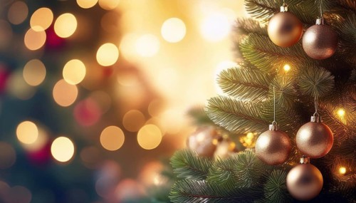 Festive christmas tree with golden baubles and warm string lights creating a magical holiday