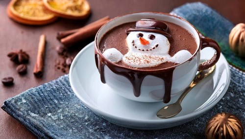 Snowman made of whipped cream floating in hot chocolate for christmas, AI generated