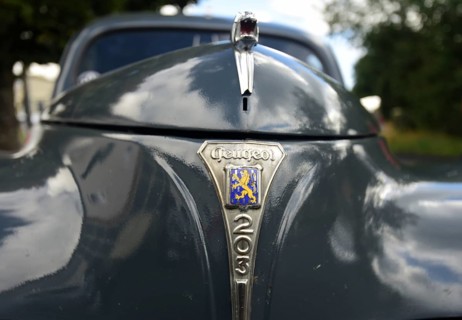 Front view of a vintage Peugeot 203, seen at a company anniversary of Energie-Mann in Westerwald